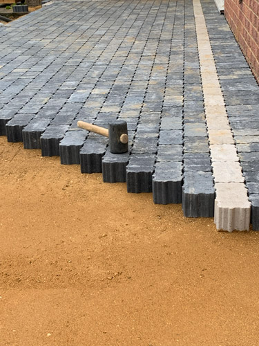 Hard Landscaping Northampton - charcoal block paving blocks with the hammer