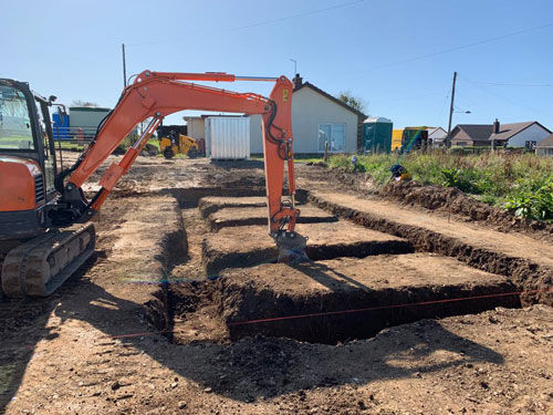 construction and groundworks Northampton excavator digging foundation on construction site