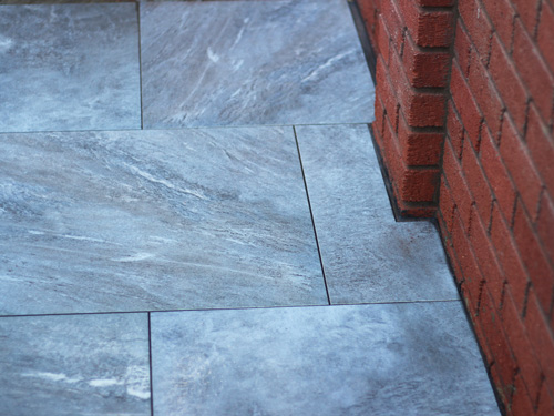 hard lanscaing Northampton project - patio with grey paving tiles