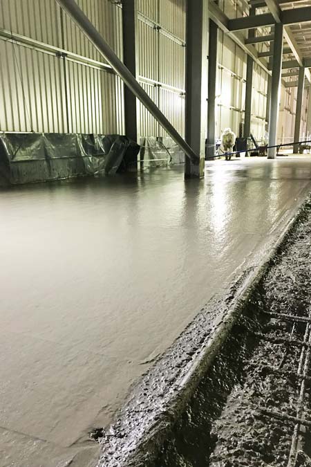 concrete flooring contractor working on industrial warehouse project